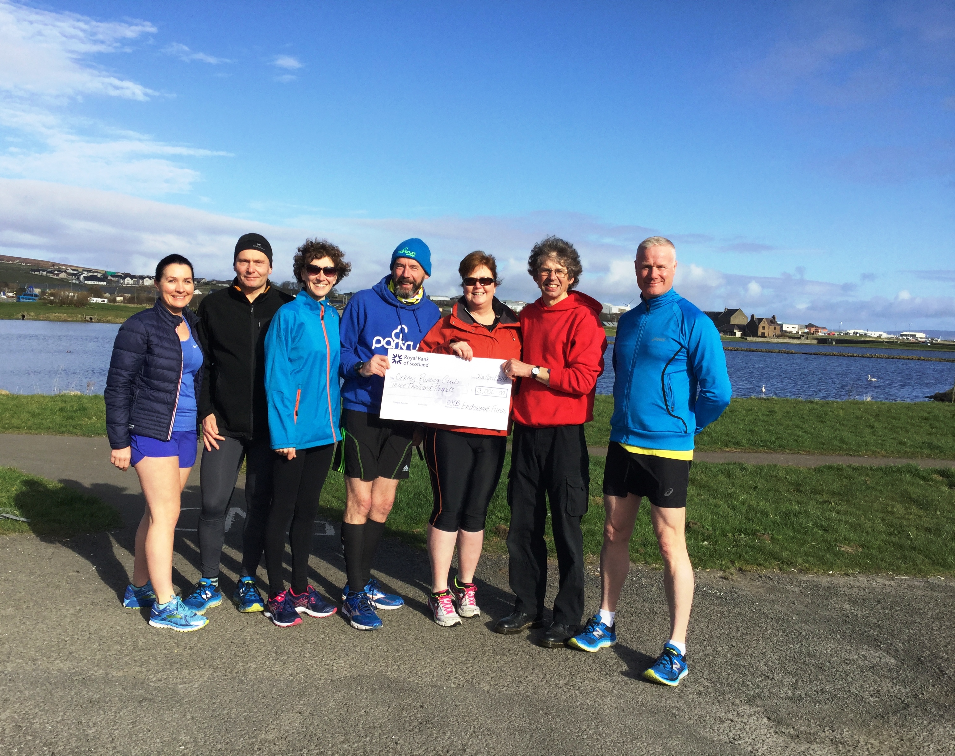 Park run photo of cheque donation for OHB Endowments Fund 