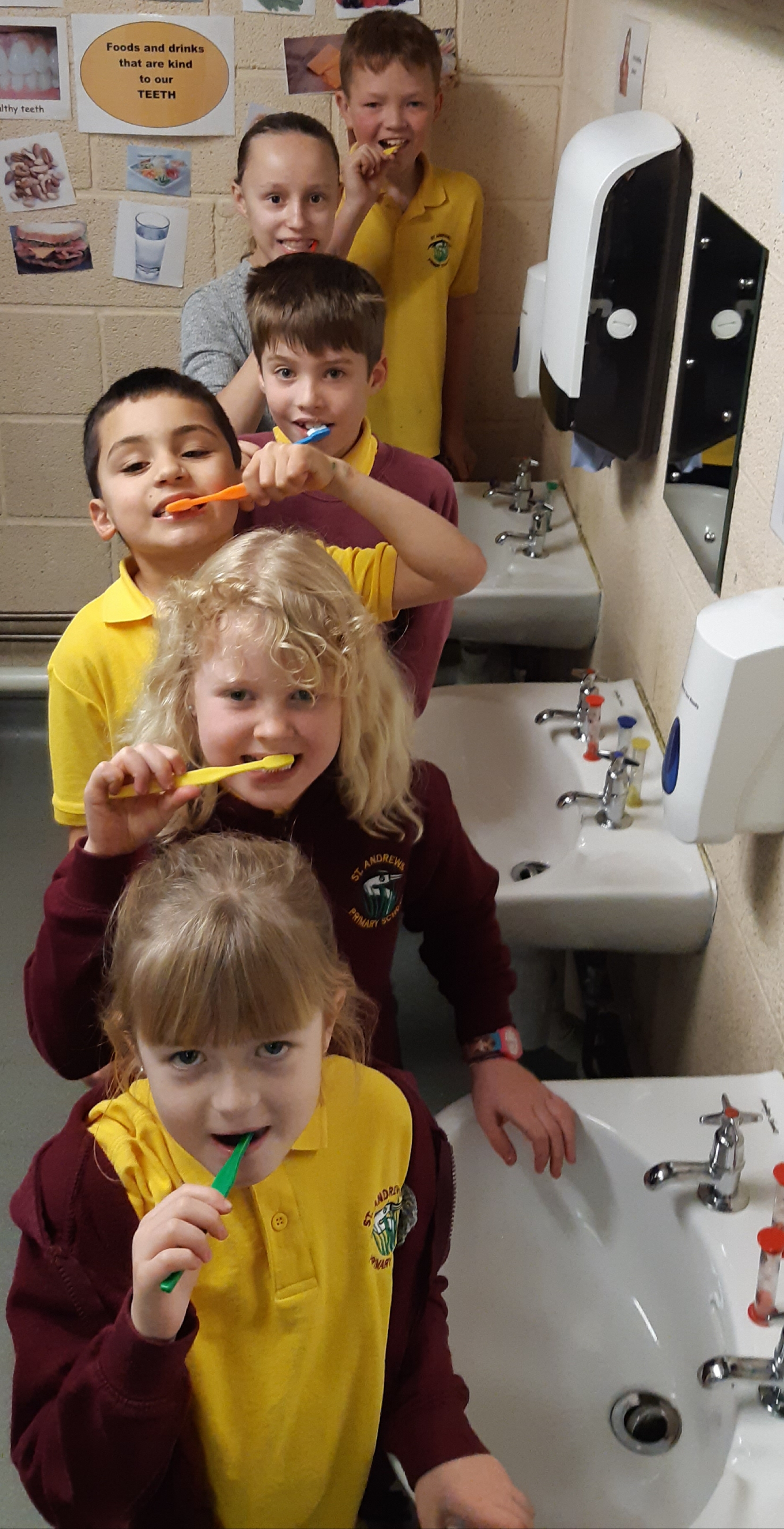 Photo of children brushing teeth 
