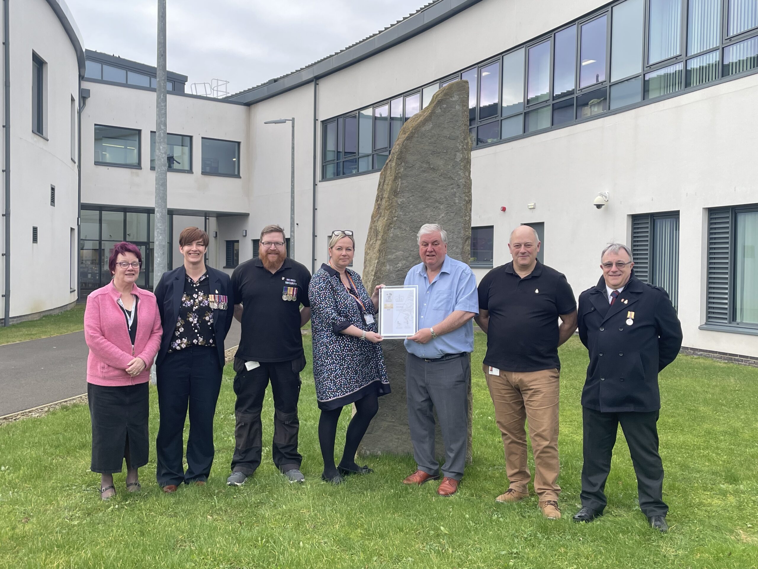 Photo of Gold Award being handed over to NHS Orkney staff